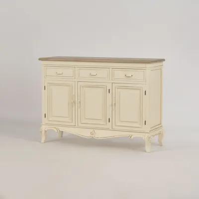 A cream and light brown wooden sideboard with three drawers and three doors, displayed against a plain white background.