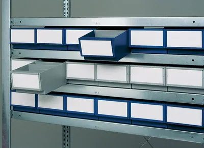 Shelving unit with storage bins.