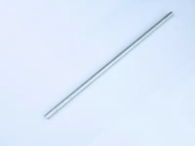 A metal rod is placed diagonally on a white background.
