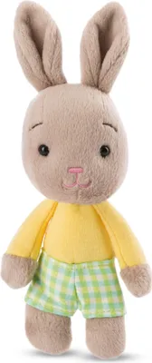 A stuffed toy rabbit standing against a white background.