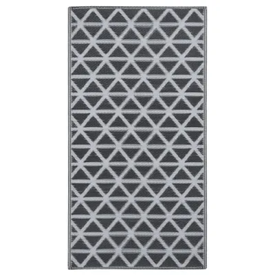 A rectangular rug with a geometric pattern of interlocking triangles in gray and white.