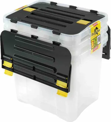 A clear studio shot of a stack of three clear plastic storage boxes with black lids and yellow latches.