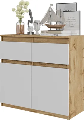 A product shot of a sideboard with decorative items on top.