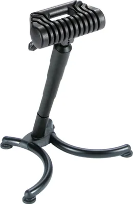 A black adjustable standing aid with a three-legged base.