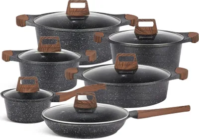 A set of cookware with speckled black pots and pans with wooden handles and glass lids, arranged on a white background.