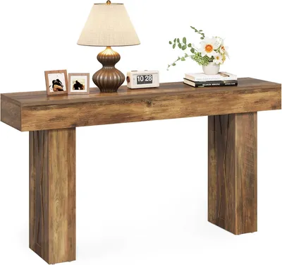 A wooden console table with decorative items on top, set against a white background.