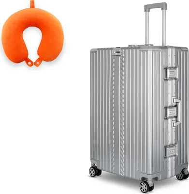 A silver suitcase and an orange neck pillow are displayed against a white background.