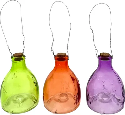 Three glass bottles with cork stoppers and wire hangers, each in a different color: green, orange, and purple.