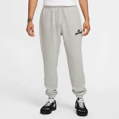 Produktbild von Nike M Nk Club Bb Cf Pant Nsw Gfx Dk Grey Heather/Black/Black Dk Grey Heather/Black/Black M