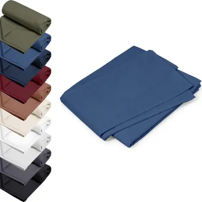 A stack of folded fabric sheets in various colors, with a close-up of a blue sheet in the foreground.