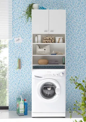 A white washing machine with a white cabinet unit above it, in a laundry room with blue tiled walls.