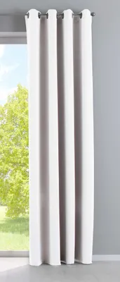 A white curtain hanging in front of a window with trees visible outside.