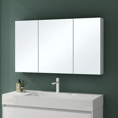 A modern bathroom vanity with a triple-door mirrored medicine cabinet above it.