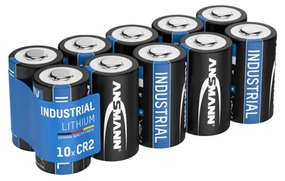 A group of ten CR2 lithium batteries in a blue plastic holder.