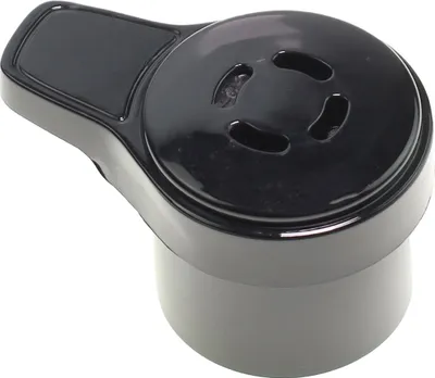 A close-up of a black pressure cooker valve.