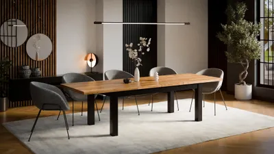 A modern dining room with a wooden dining table and chairs, a large plant, and decorative elements.