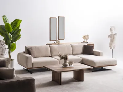 Immagine prodotto di Elegante divano angolare a L beige in tessuto per un soggiorno moderno