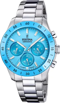 A close-up studio shot of a Festina ceramic chronograph watch with a blue dial and stainless steel band.