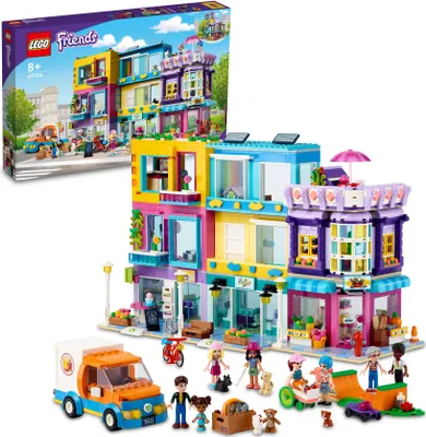 Produktbild von LEGO 41704 Friends Wohnblock in Heartlake City mit Friseursalon und Café, Puppenhaus mit 7 Minipuppen, Hausmodell mit Wohngebäuden, Geschenkidee Weihnachten