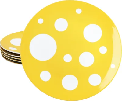 A stack of yellow plates with white polka dots.