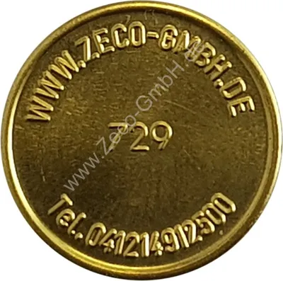A close-up, circular image of a gold-colored token with embossed text and numbers.