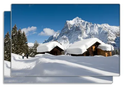 Produktbild von Wallario Frühstücksbrettchen 2er Set aus Glas, je 20 x 30 cm, mit rutschfesten Füßen, Motiv Verschneiter Almhütten vor einem Gipfel