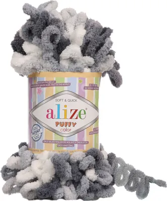 A spool of Alize Puffy Color yarn with loops of yarn spilling out.