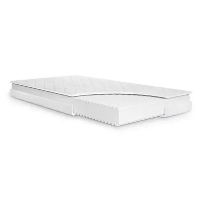 A cutaway view of a white mattress on a white background.