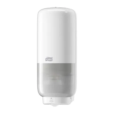 A white and gray Tork sensor soap dispenser against a white background.