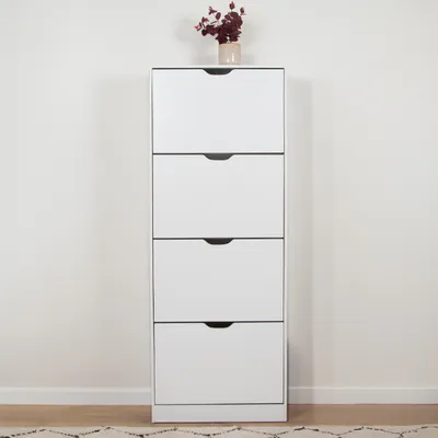 A tall, white shoe cabinet with four drawers is shown against a plain wall.