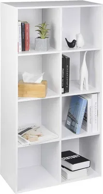 A white cube shelf unit filled with various decorative items and books.