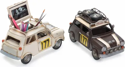 Two decorative metal cars, one white and one brown, displayed side-by-side against a white background.