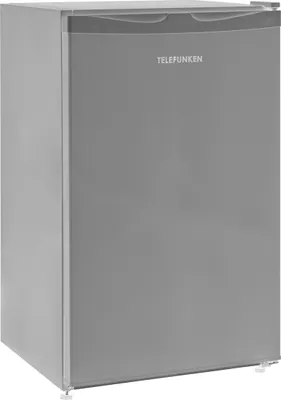A freestanding refrigerator in a studio setting.