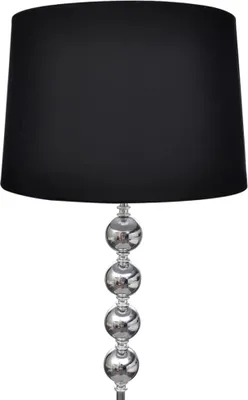A black lampshade sits atop a silver lamp base with four decorative spheres.