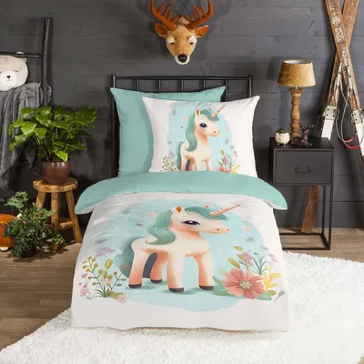 A child's bedroom with unicorn-themed bedding.