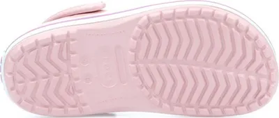 The bottom view of a pink Crocs shoe.