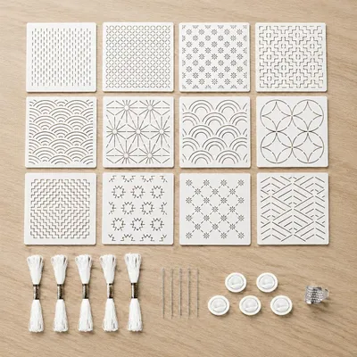 Produktbild von Sashiko Schablonen Set - 28-teilig mit Stickzubehör - Geometrische Stickmuster - 12x12 cm