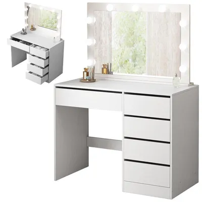 A white vanity table with a lighted mirror and drawers.