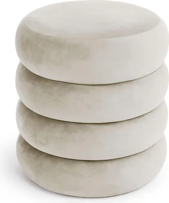 Four round, upholstered ottomans stacked on top of each other.