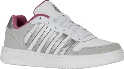 A studio shot of a single white K-Swiss sneaker with gray and silver accents.