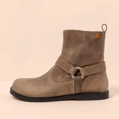 A side view of a brown leather boot.