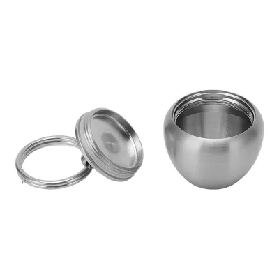 Produktbild von Pillendose aus Edelstahl, Apfelform, tragbare Mini-Pillendose aus Edelstahl, versiegeltes Glas, Schlüsselanhänger