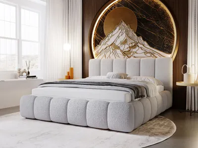 A modern bedroom with a large upholstered bed as the focal point, decorated with a circular mountain-themed artwork.