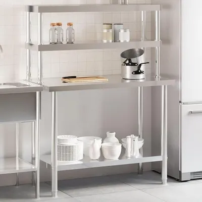 Image de Table de travail de cuisine en acier inoxydable avec plateau supérieur, dimensions 110 x 55 x 150 cm, équipée d'une étagère inférieure et de 2 étagères, idéale pour les restaurants, les cuisines professionnelles, les bars, les hôtels et les services de traiteur
