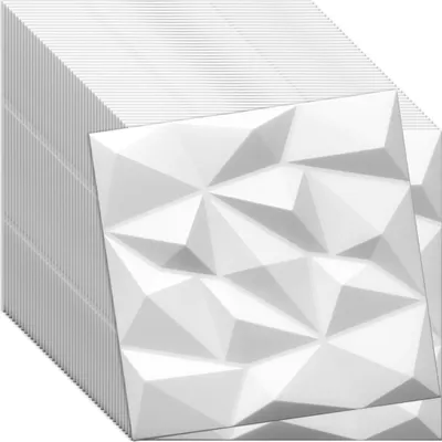 A stack of white 3D wall panels with a geometric, faceted design.