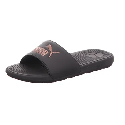 A single black Puma slide sandal with a rose gold Puma logo is shown against a white background.