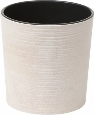 A close-up studio shot of a white textured plant pot with a black interior.