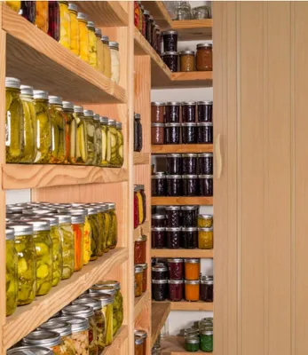 A pantry stocked with jars of preserved food.