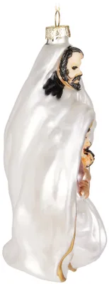 A close-up side view of a Christmas ornament depicting a nativity scene.