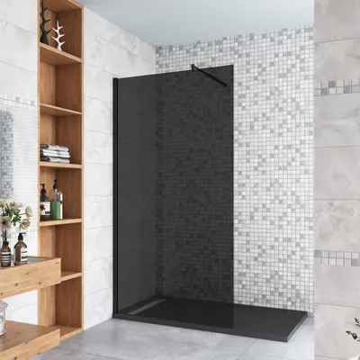 A modern bathroom with a walk-in shower, shelving unit, and decorative elements.